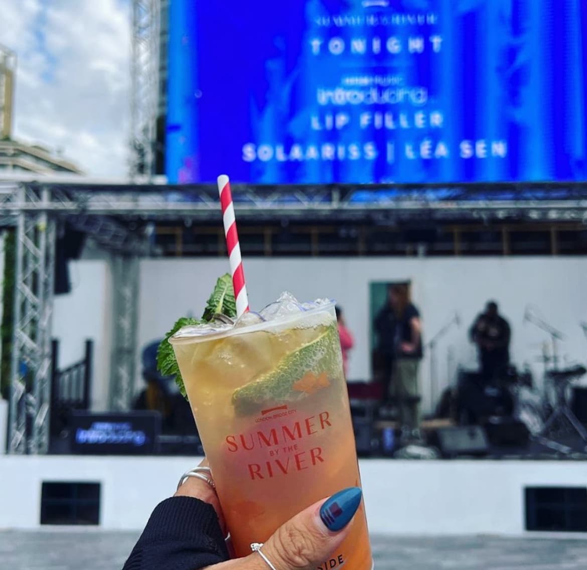 Reusable plastic cups being used at a green outdoor event