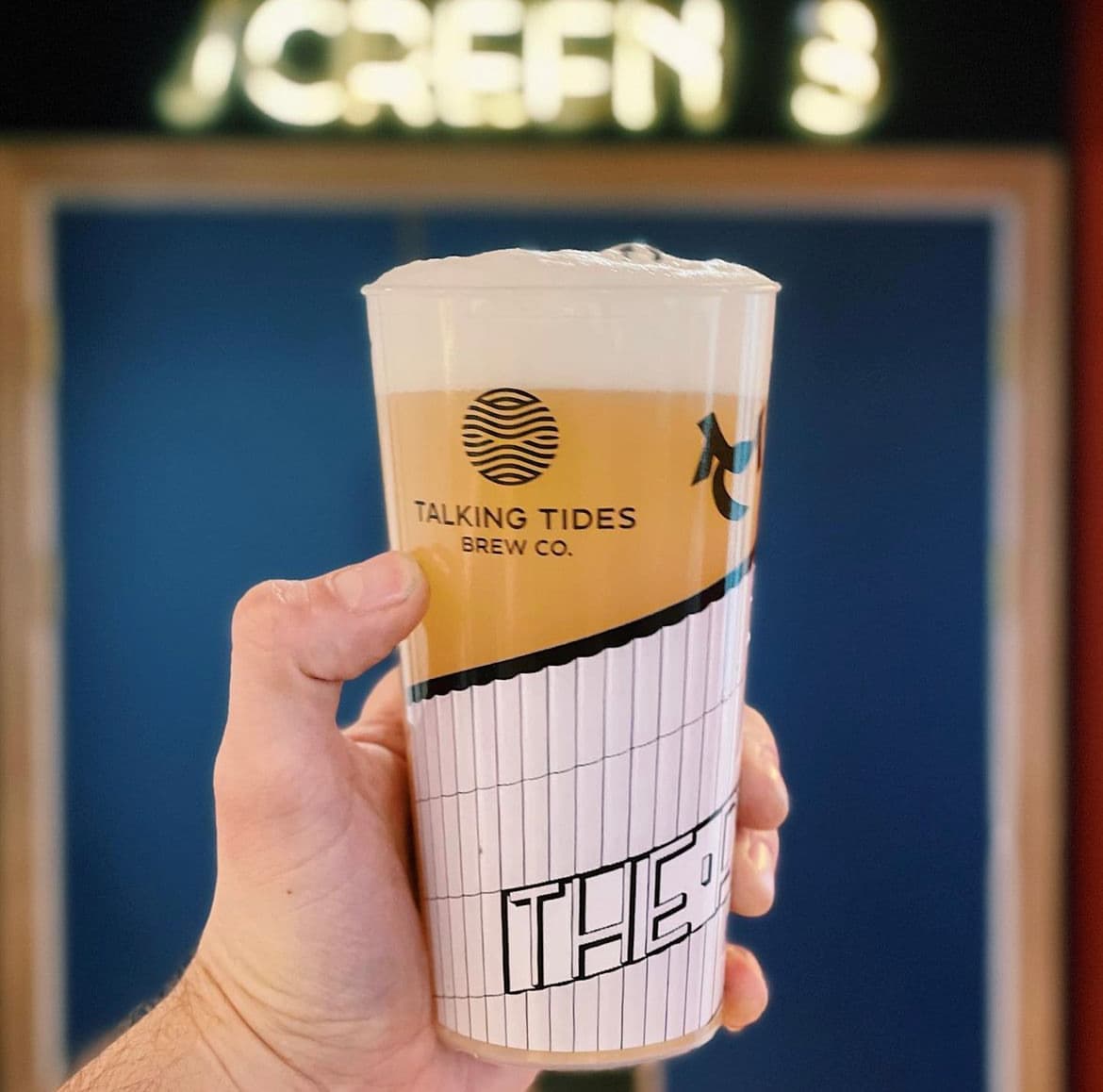 Bartender easily pulling a cup from a tall stack