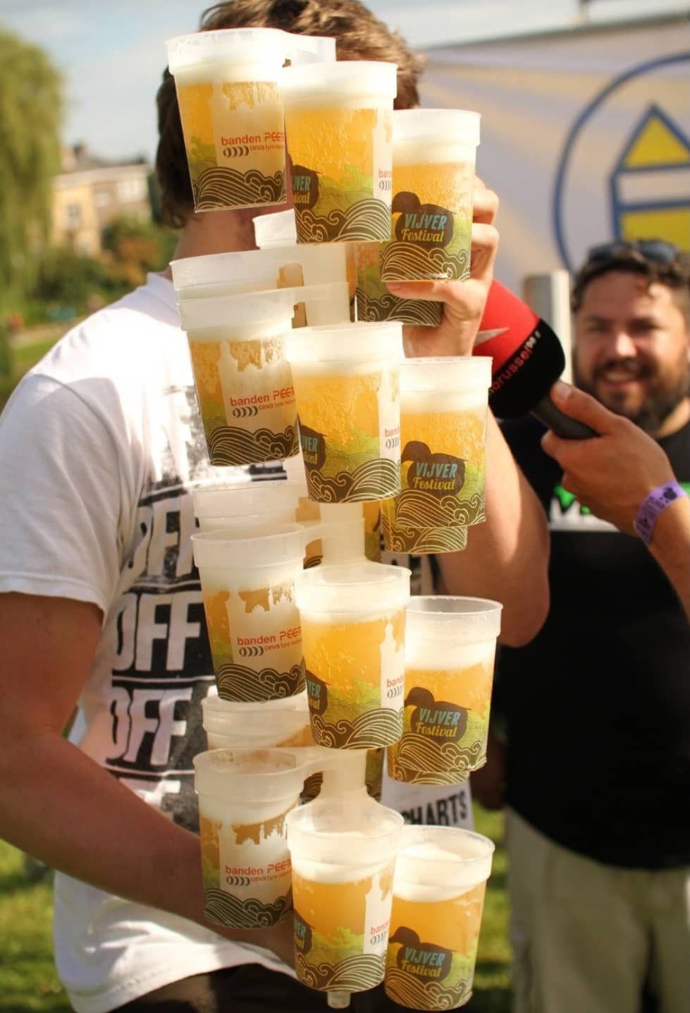 Branded printed pint cups at an outdoor bar